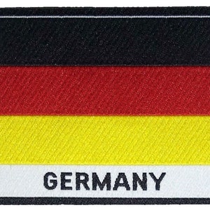 May include: A black, red and yellow German flag patch with the word "GERMANY" printed in black below the flag.