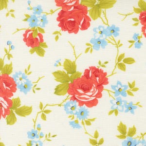 May include: Floral fabric with a repeating pattern of red roses, small blue flowers, and green leaves on a cream background. The design has a vintage, cottagecore aesthetic, suitable for quilting or apparel.