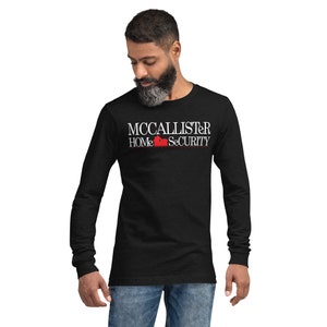 McCallister Home Security Texto blanco Unisex Camiseta de manga larga