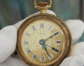 Reloj de bolsillo con alarma Kramer vintage, fabricado en Suiza, con caja de 53 mm en tono dorado.
