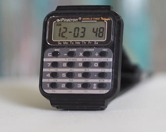 1980's PIRATRON World Time Calculator LCD watch - unworn, mint condition