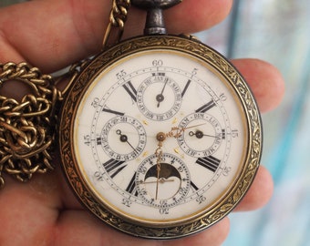 Reloj de bolsillo Goliath suizo antiguo con triple calendario y fases lunares, caja de 67 mm en bronce, siglo XIX