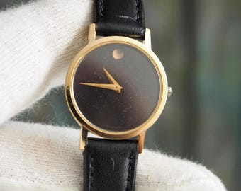 Movado Museum Ladies Quartz Watch 87-25-832 Black Dial Gold Case 25mm