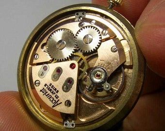 ACCURIST - .375 , 9K Gold Swiss Made Mechanical Wind up Mens