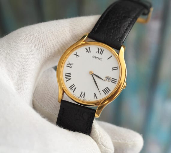 Vintage Seiko Gold-tone Quartz Watch: 35mm Roman Dial, Black
