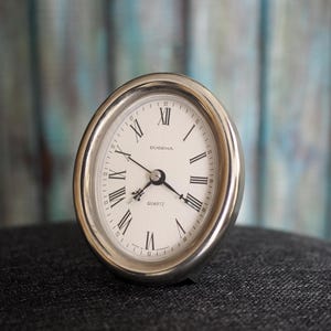 Vintage Dugena Quartz Desk Clock – German Made Battery Operated – Silver Tone Round Clock with Roman Numerals – Working Retro Decor