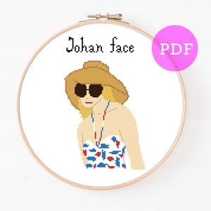 May include: Cross stitch pattern featuring a woman wearing a straw hat, sunglasses, and a swimsuit with a red, white and blue pattern. The text "Johan face" is above the woman. The pattern is in PDF format.