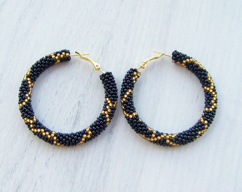 black snake hoop earrings
