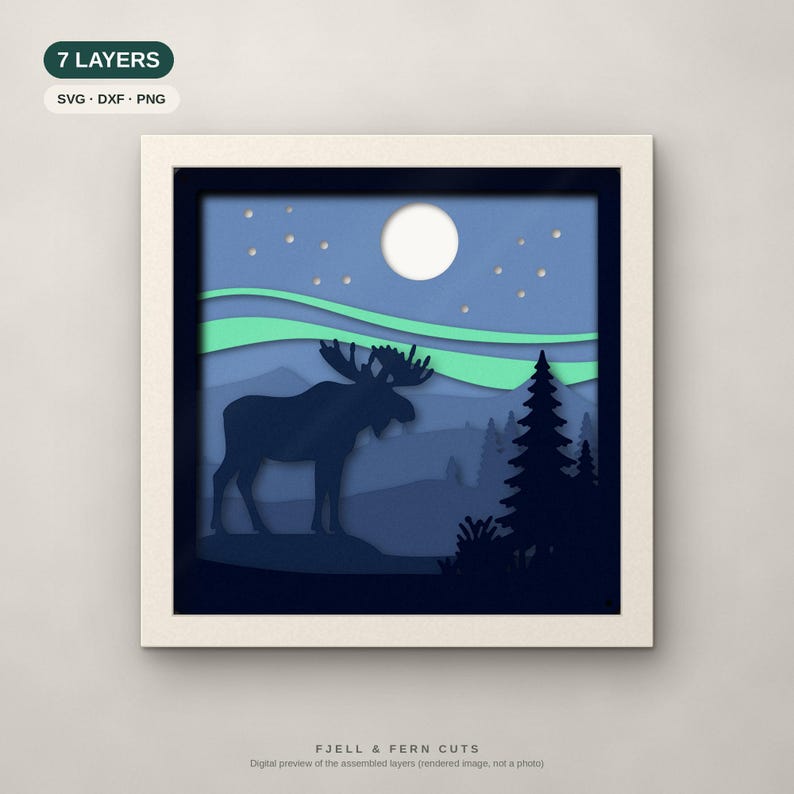 May include: A square framed 7-layer paper art piece featuring a dark blue moose silhouette standing in a forest landscape under a light blue sky with a white moon, stars, and green aurora borealis. Text includes 7 LAYERS, SVG, DXF, PNG, and FJELL & FERN CUTS.