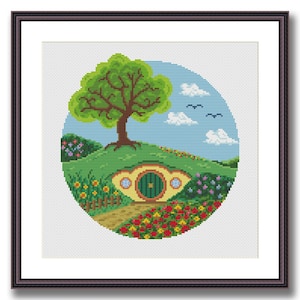 May include: A cross-stitch pattern of a green hobbit hole with a yellow door and a round window. The hobbit hole is nestled in a green hill with a tree and flowers. The background is a blue sky with white clouds.