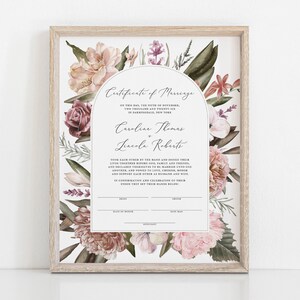 May include: A printable marriage certificate with a floral design featuring pink, white, and green flowers. The text reads "Certificate of Marriage" and includes the names "Caroline Thomas" and "Lincoln Roberts".
