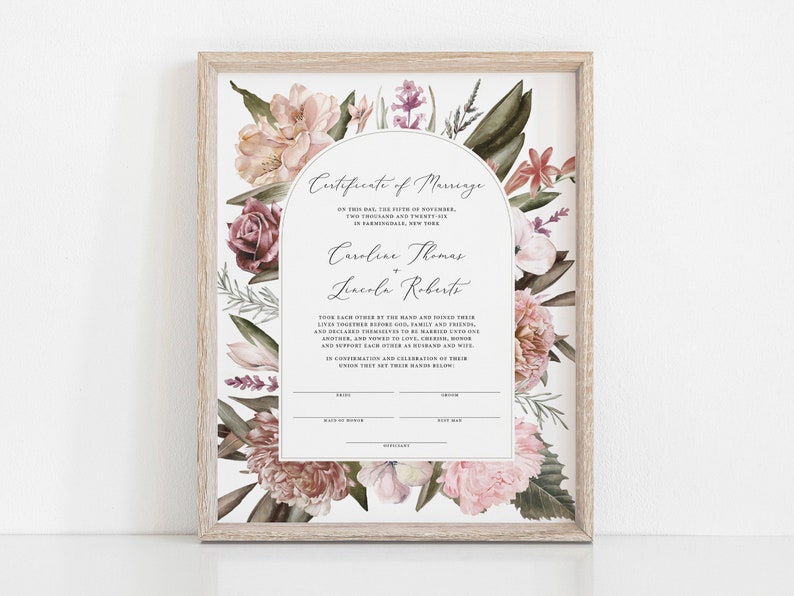 May include: A printable marriage certificate with a floral design featuring pink, white, and green flowers. The text reads "Certificate of Marriage" and includes the names "Caroline Thomas" and "Lincoln Roberts".