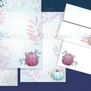May include: Set of four printable stationery sheets featuring watercolor illustrations of pumpkins in various colors and styles. The sheets have a light blue background with a subtle floral pattern.