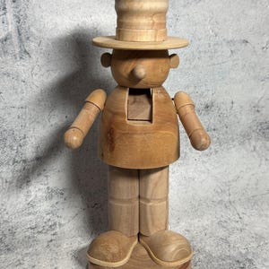 May include: A rustic wooden sign with the text "Welcome to our home" in a handwritten style. The sign features a distressed finish and a simple, inviting design, perfect for a front porch or entryway.