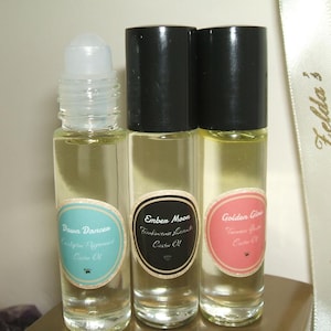 May include: A white ceramic mug with a black handle and the text "But First, Coffee" in a black, bold font. The mug is sitting on a white surface. The mug is approximately 4 inches tall.