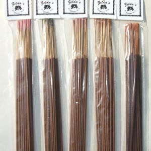 May include: Five packs of brown incense sticks in clear plastic packaging. Each pack has a white label with the text "Zelda's Kitchen, NY" printed on it.