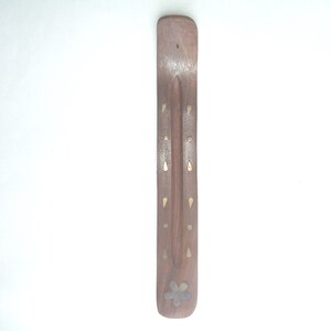 A handmade incense burner made by Mystic in India handcrafted with care with brass inlayed design