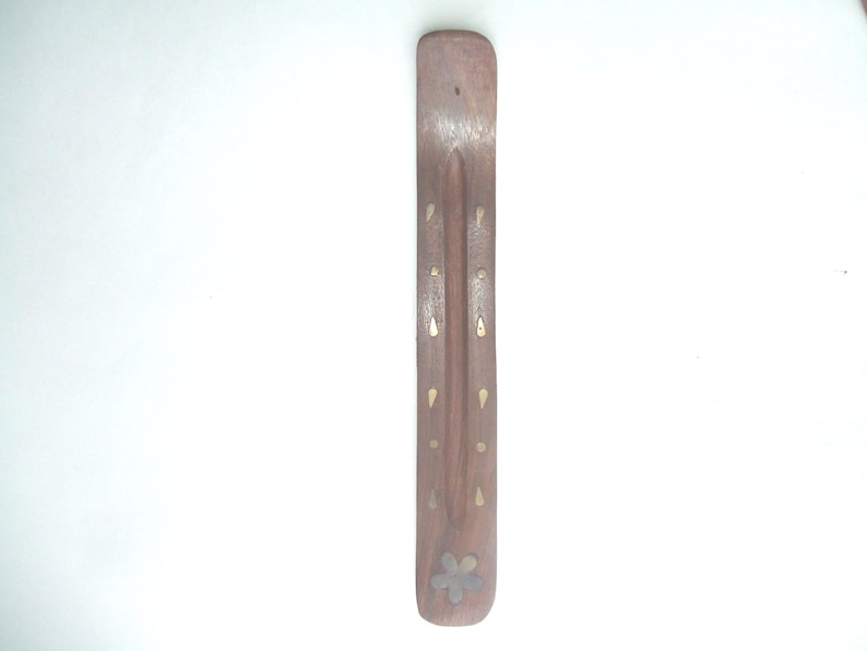A handmade incense burner made by Mystic in India handcrafted with care with brass inlayed design