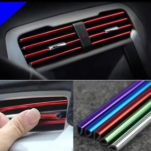 May include: A set of U-shaped decorative trim strips for car air conditioning vents. The strips are available in metallic red, blue, purple, green, and silver finishes. They are designed to slide onto the horizontal vent slats.