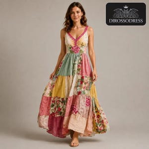 May include: A floor-length sleeveless dress featuring a patchwork design with various floral patterns in shades of pink, yellow, green, and cream. The bodice has a V-neckline with pink trim and a central rose detail. The logo DIROSSODRESS is visible.