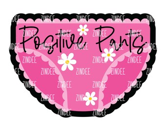 Op de afbeelding: Roze ondergoed met de tekst "Positive Pants" in zwart script. Het ondergoed heeft een zwarte geschulpte rand en witte madeliefjesaccenten. Het woord "ZINDEE" wordt herhaald in het hele ontwerp.