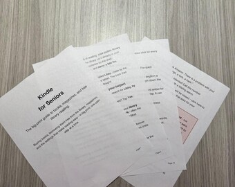 May include: A stack of white printed pages titled Kindle for Seniors, featuring large black text. The document provides a big-print guide to borrowing books, magazines, and library reading, with instructions on using the Libby app and troubleshooting common Amazon account security alerts.