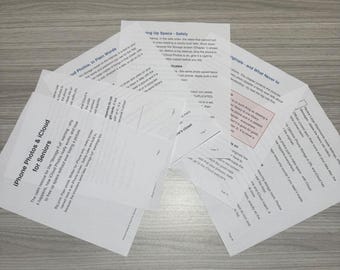 May include: A stack of white printed pages titled iPhone Photos & iCloud for Seniors, featuring black text on white paper. The documents contain instructional content about managing digital storage, photo libraries, and cloud settings.
