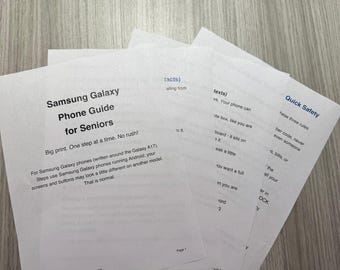 May include: A stack of white paper sheets containing a Samsung Galaxy Phone Guide for Seniors. The text includes instructions for Samsung Galaxy phones, specifically the Galaxy A17, and a section titled Quick Safety with black text.