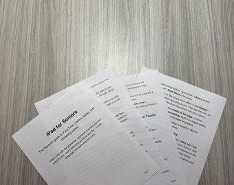 May include: A stack of white printed paper sheets titled iPad for Seniors, featuring a big-print guide to FaceTime, photos, books, and browsing safely. The text includes instructions on using the Libby app, adjusting brightness, and navigating the library.