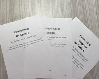 May include: Three white printed paper guides titled iPhone Guide for Seniors, Safety Guide for Seniors, and Facebook & Instagram for Seniors. Each document features black text with instructions for Apple iPhone users, emphasizing large print and step-by-step guidance.
