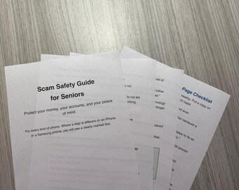 May include: A stack of white paper documents titled Scam Safety Guide for Seniors, featuring text about protecting money and accounts, with a Page Checklist visible on the top right sheet, all printed in black ink on standard letter-sized paper.