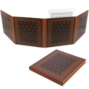 May include: A four-panel folding game master screen featuring a dark brown and black color scheme with a repeating Celtic knot border pattern. The screen is shown both fully unfolded and folded into a compact, flat rectangular stack.