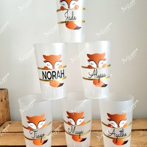May include: Six clear plastic cups with orange fox designs and personalized names: Jade, Norah, Alyssa, Tiago, Maya, and Agathe.