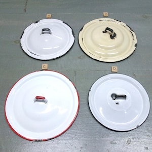 May include: A set of three ceramic mugs with a speckled, matte finish. The mugs are in shades of cream, light gray, and dark gray. Each mug has a simple, minimalist design and a rounded handle.