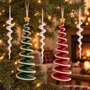 May include: A set of crochet Christmas ornaments hanging from a tree, including two spiral-shaped green and red trees with yellow star toppers and three white spiral icicles, all crafted with fine yarn and white hanging loops.