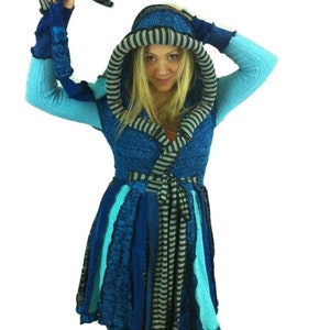 May include: A blue and gray hooded cardigan with a long, flowing skirt. The cardigan is made of a soft, knitted fabric and has a unique, layered design.
