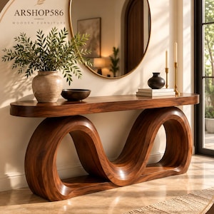 May include: A solid wood console table featuring a smooth, elongated oval top and a continuous, wave-like sculptural base. The natural brown wood grain is visible throughout the piece. The text ARSHOP586 WOODEN FURNITURE is visible.
