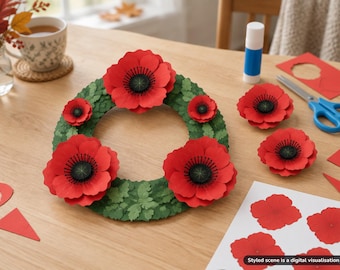 Könnte beinhalten: Ein runder Kranz aus geschichteten grünen Papierblättern, verziert mit mehreren großen, leuchtend roten Mohnblumen aus Papier mit dunklen Mitten. Zusätzliche lose Mohnblumen aus Papier und ein Bogen mit Mohnblumen-Ausschnitten liegen daneben.
