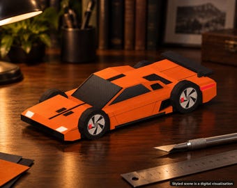 Könnte beinhalten: Ein leuchtend orangefarbenes Sportwagenmodell aus Papier mit schwarzen Akzenten, einem Heckspoiler und geometrischen Raddesigns. Das Auto hat eine flache Karosserie, eine kantige Windschutzscheibe und Scheinwerfer. Ein Metalllineal ist sichtbar.