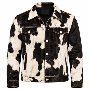 May include: A long-sleeve jacket featuring a black and white cow print pattern. The jacket includes a pointed collar, a front button closure with silver-toned metal buttons, two chest pockets with buttoned flaps, and a black interior lining.