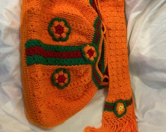 Handmade crochet bag with matching scarf, orange, red, green floral.