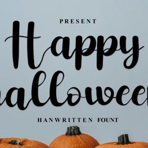 May include: A digital graphic featuring the black text "PRESENT", "Happy halloween", and "HANWRITTEN FOUNT" in a cursive script style, positioned above three orange pumpkins with dark green stems against a light blue background.