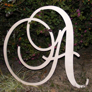 May include: A large, wooden letter A with a decorative, cursive font. The letter is unpainted and has a natural wood finish.