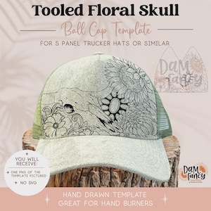 May include: A light green trucker hat template featuring a black line art design of a skull surrounded by sunflowers and floral patterns. The text reads Tooled Floral Skull Ball Cap Template for 5 panel trucker hats or similar.
