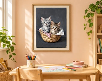 May include: A framed wall art print featuring two tabby kittens sitting inside a woven wicker basket. One kitten is gray and white, while the other is brown and black. The kittens are nestled on a white and pink checkered cloth against a dark background.
