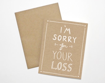 May include: A brown card with white text that reads "I'm sorry for your loss".