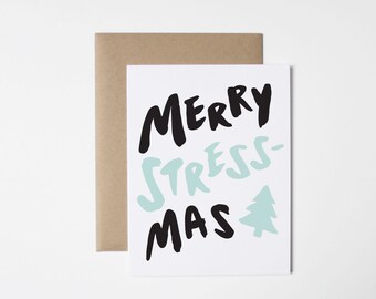 May include: A white card with black and light blue text that reads "Merry Stress-Mas" with a light blue stylized Christmas tree.