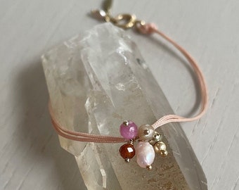 salmon pink cord bracelet with pearls, gemstone, and charms / sterling silver