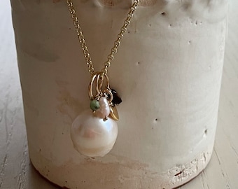 large freshwater pearl and charms pendant