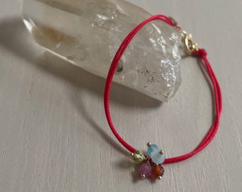 red cord bracelet with pearls, gemstone, and charms / gold filled